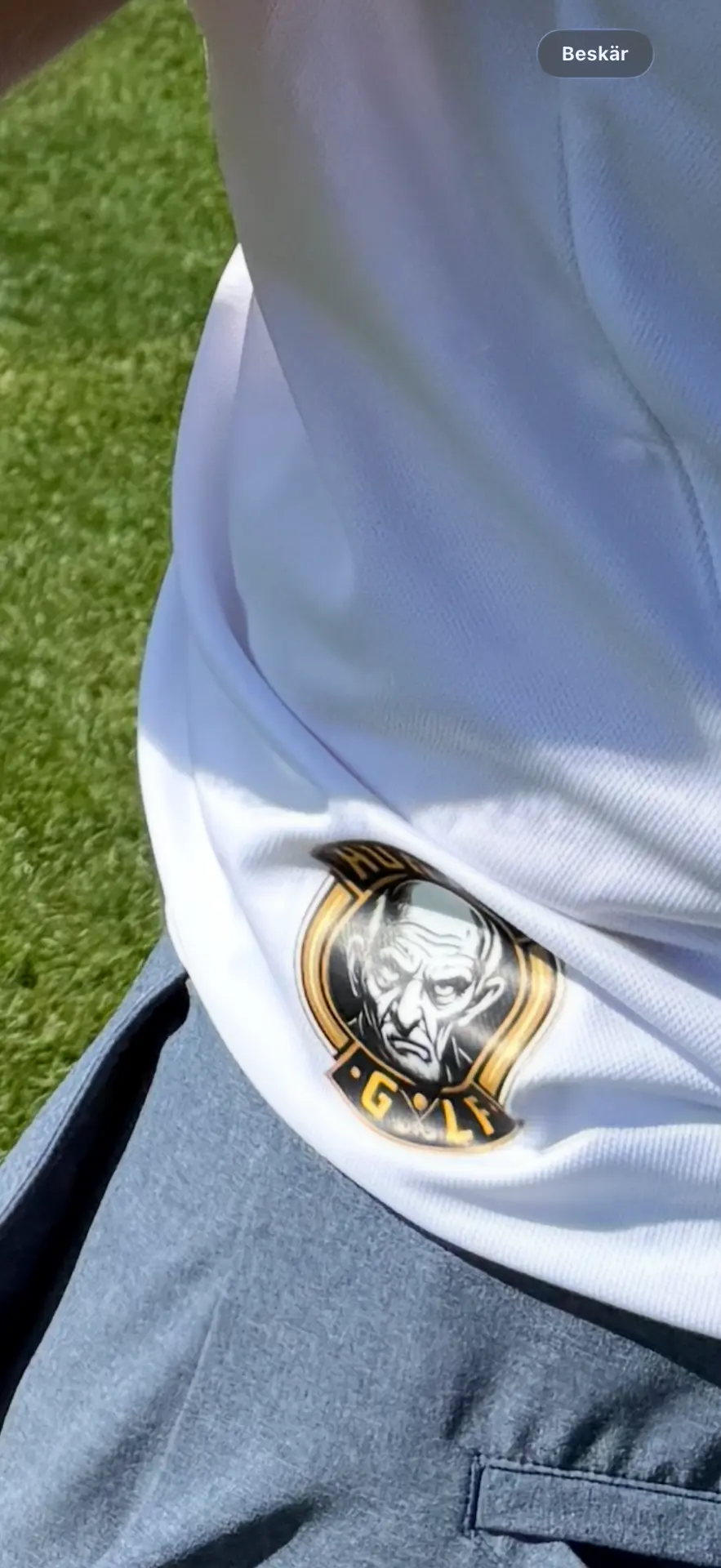 Hurry Golf crest on a club polo